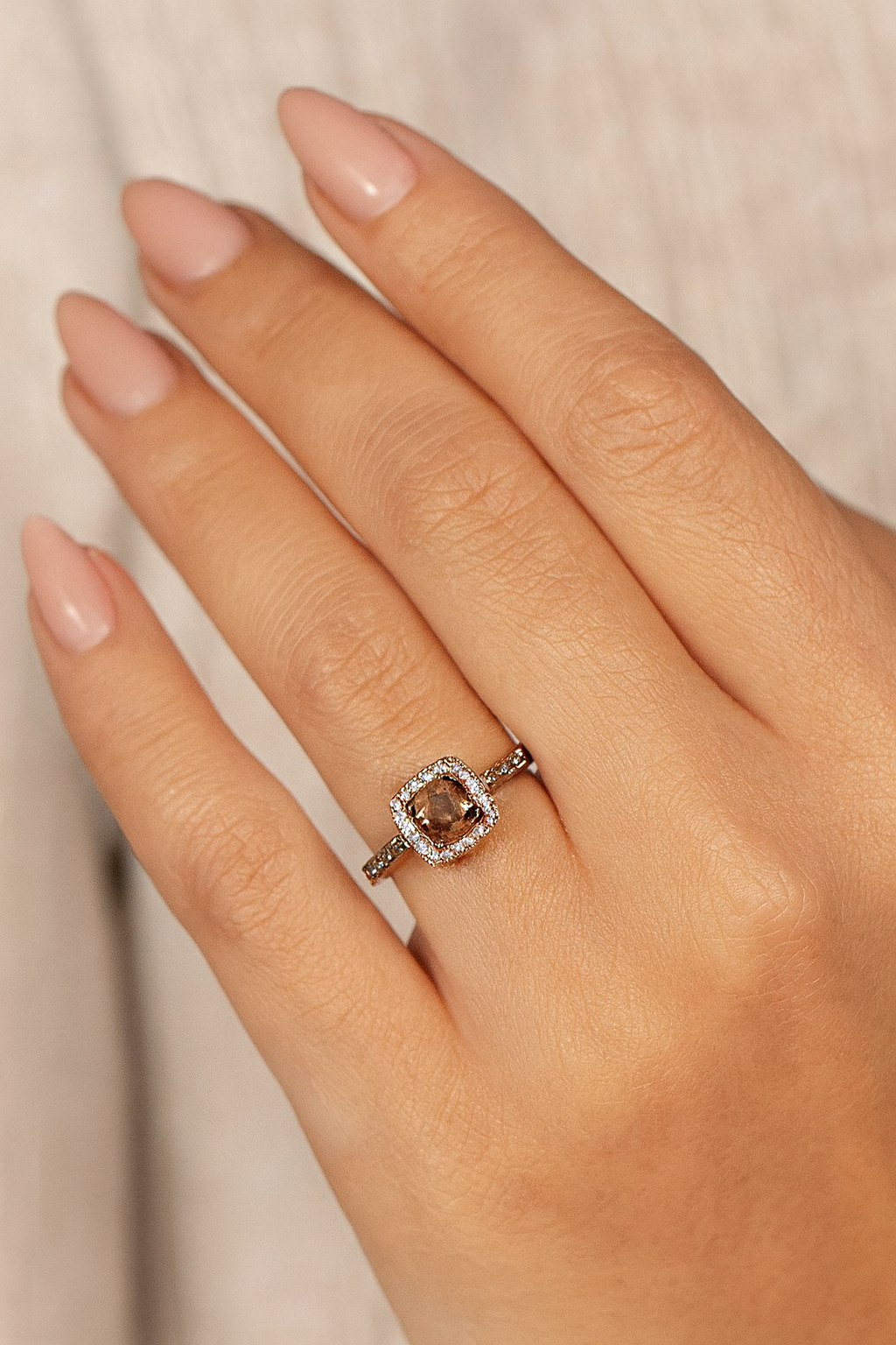 Le Vian 14K rose gold smoky quartz diamond halo ring on model’s hand