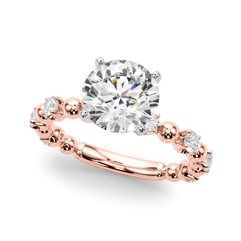 Angled view of the round diamond engagement ring with a rose gold beaded band and diamond accents