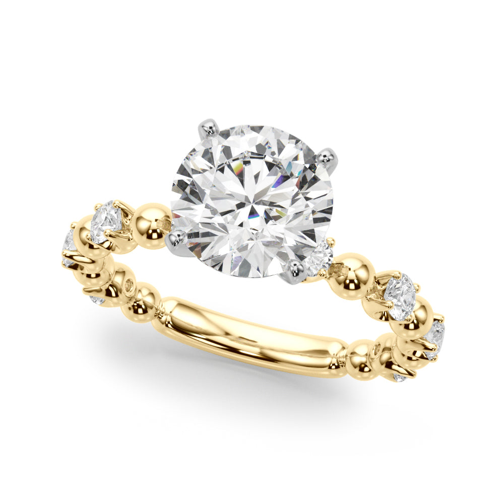 Angled view of the round diamond engagement ring with polished yellow gold beads and diamond accents.