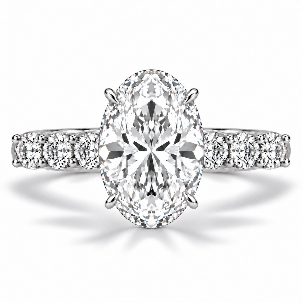 Front view of an oval lab-grown diamond engagement ring with a 4.50-carat center diamond and round diamonds set along both sides of the band.