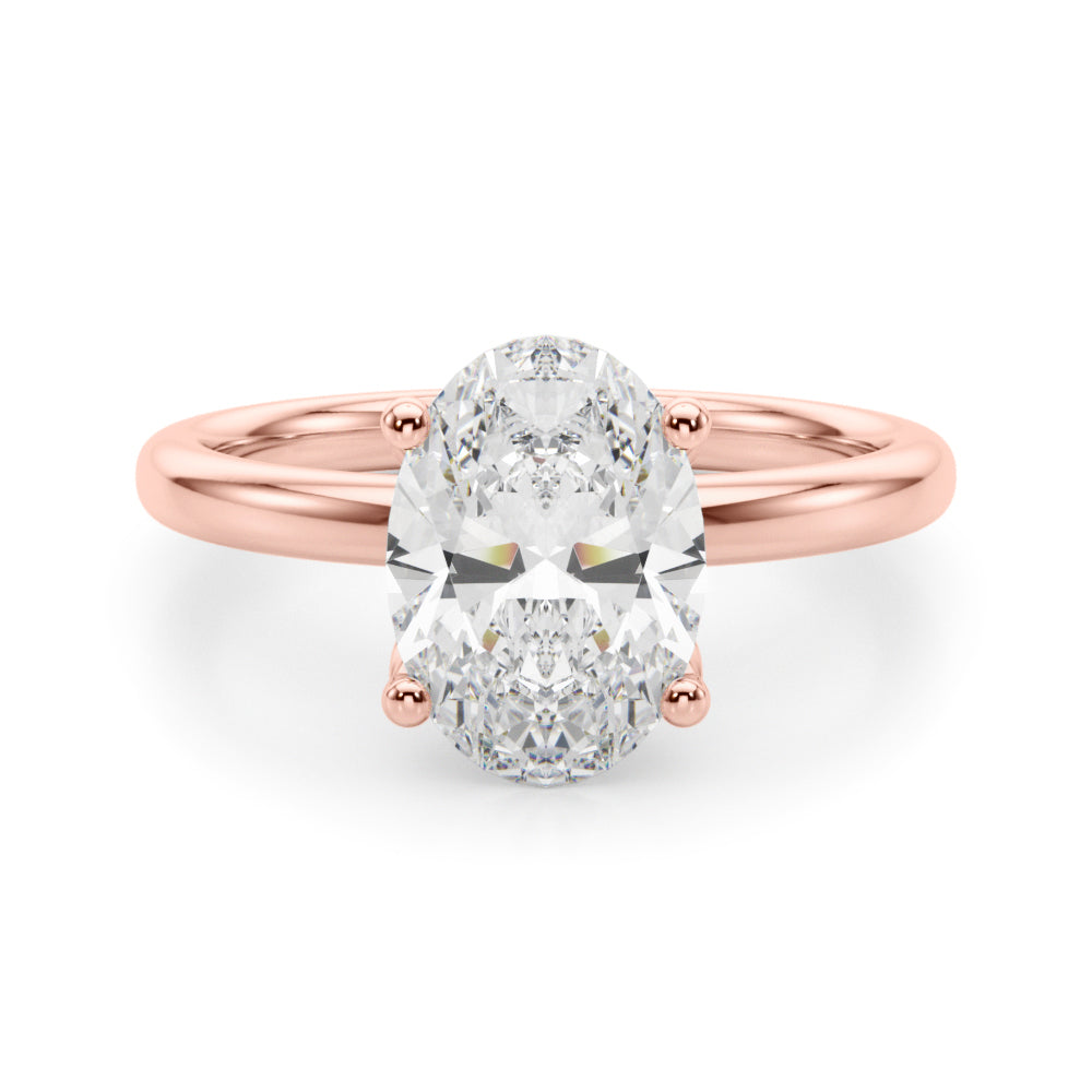 Oval-cut lab-grown diamond engagement ring in 14K rose gold with a hidden halo and four-prong solitaire setting, featuring a 2.20 ct IGI-certified diamond (E-F color, VS-VVS clarity).