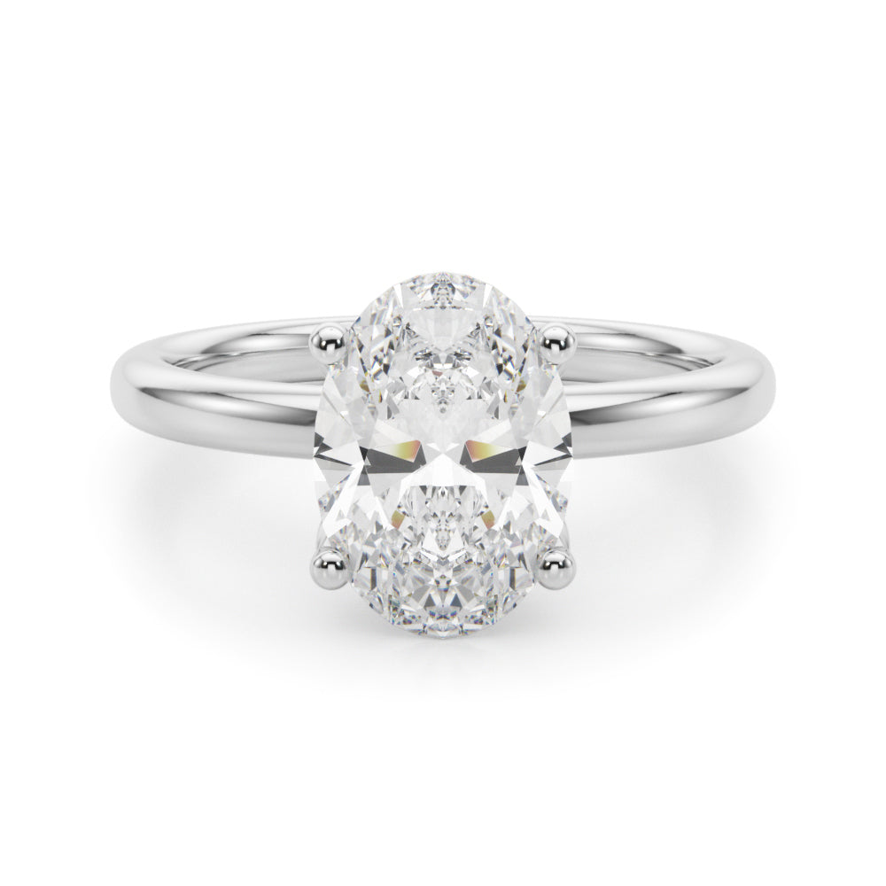 Oval-cut lab-grown diamond engagement ring in 14K white gold with a sleek hidden halo and four-prong solitaire setting, featuring a 2.20 ct IGI-certified diamond (E-F color, VS-VVS clarity).