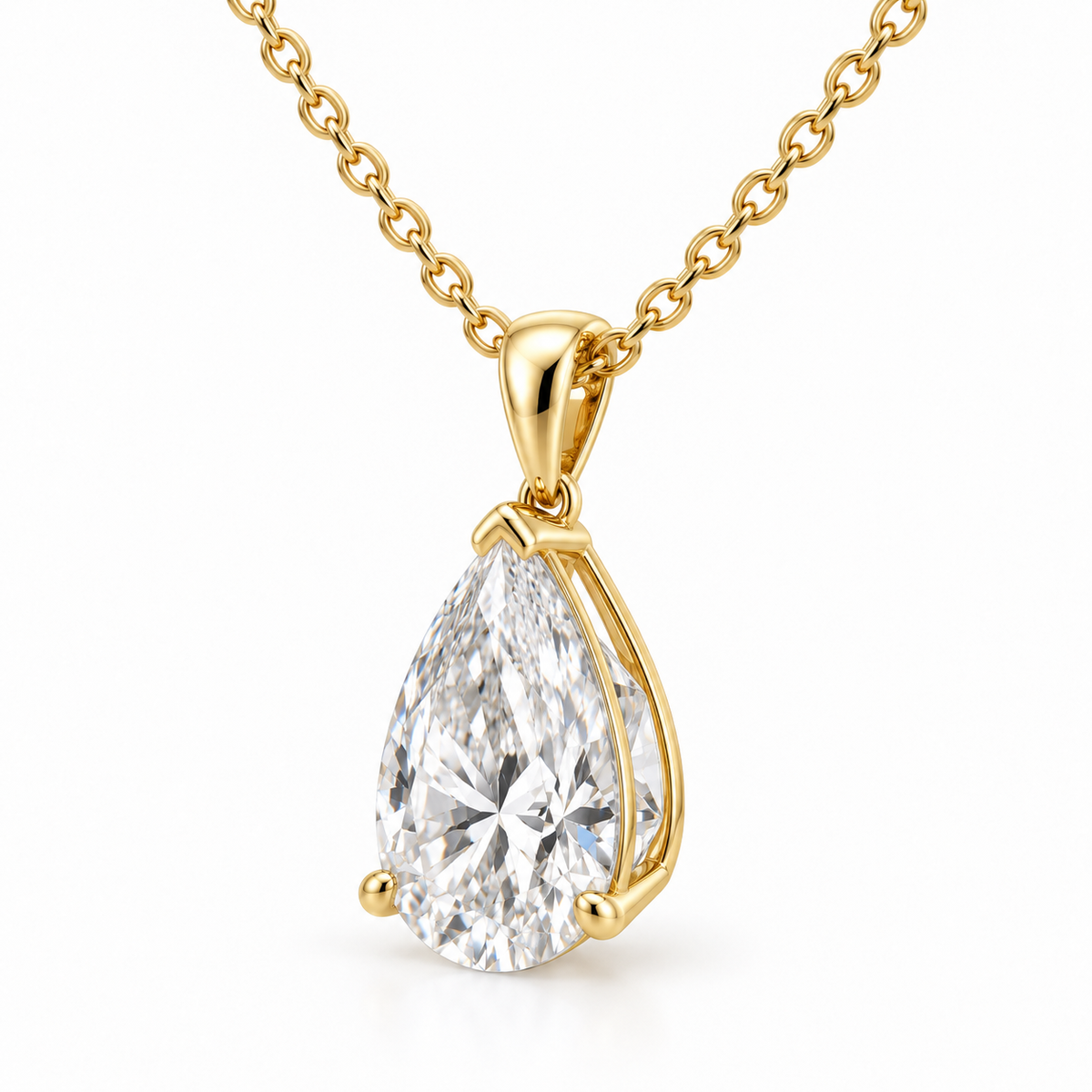 Side view of pear diamond pendant showing the open yellow gold basket