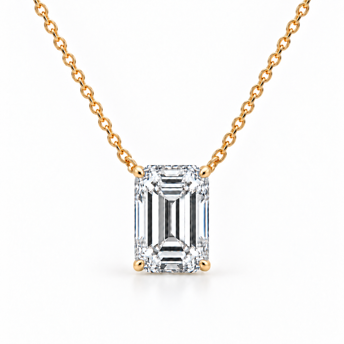 Front view of emerald-cut diamond solitaire necklace in 14K yellow gold