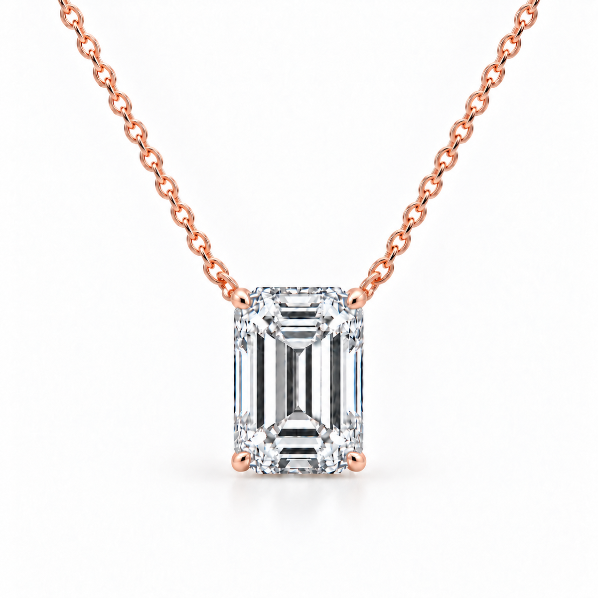 Front view of emerald-cut diamond solitaire necklace in 14K rose gold
