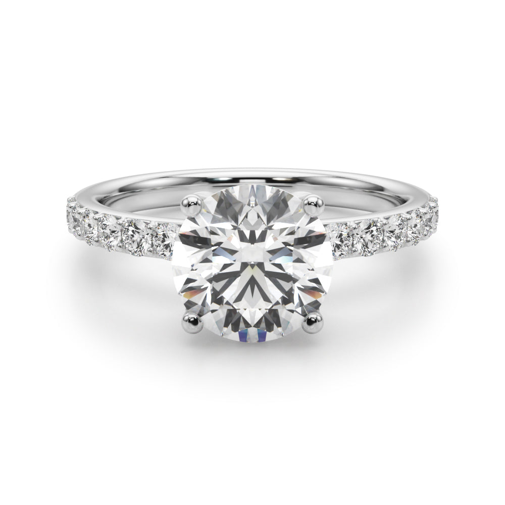 2.00 carat round diamond engagement ring in 14K white gold with pavé side stones — classic four-prong setting.