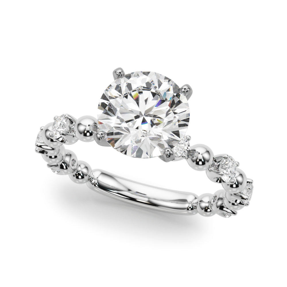 Angled view of the round diamond engagement ring showing the white gold beaded band and four-prong center setting.