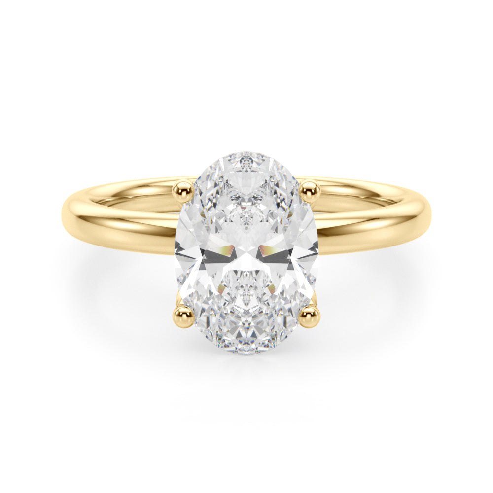 Oval-cut lab-grown diamond engagement ring in 14K yellow gold with a hidden halo and four-prong solitaire setting, featuring a 2.20 ct IGI-certified diamond (E-F color, VS-VVS clarity).