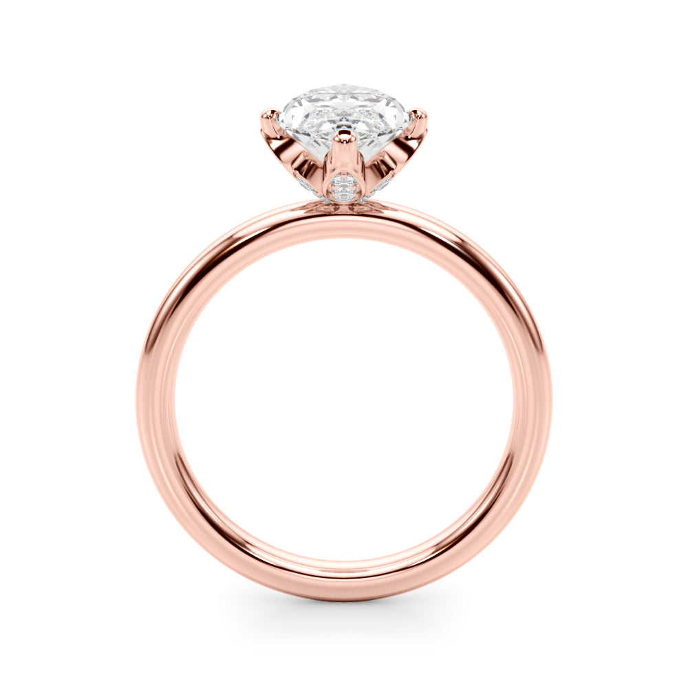 Side profile of the rose gold marquise engagement ring showing its raised setting and diamond-accented gallery.