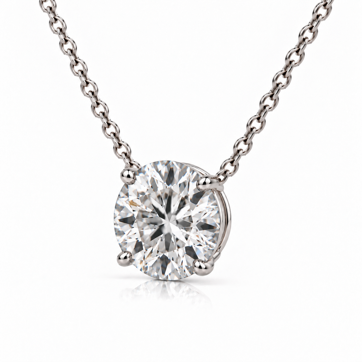 Angled view of white gold round diamond pendant showing the basket setting
