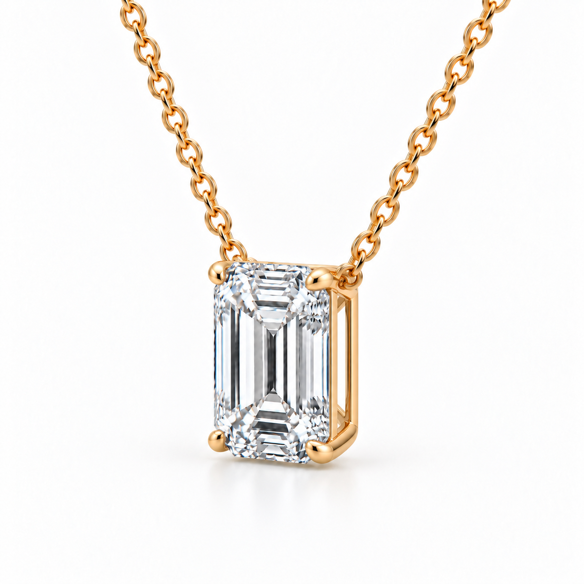 Side angle of yellow gold emerald-cut diamond pendant showing the basket setting