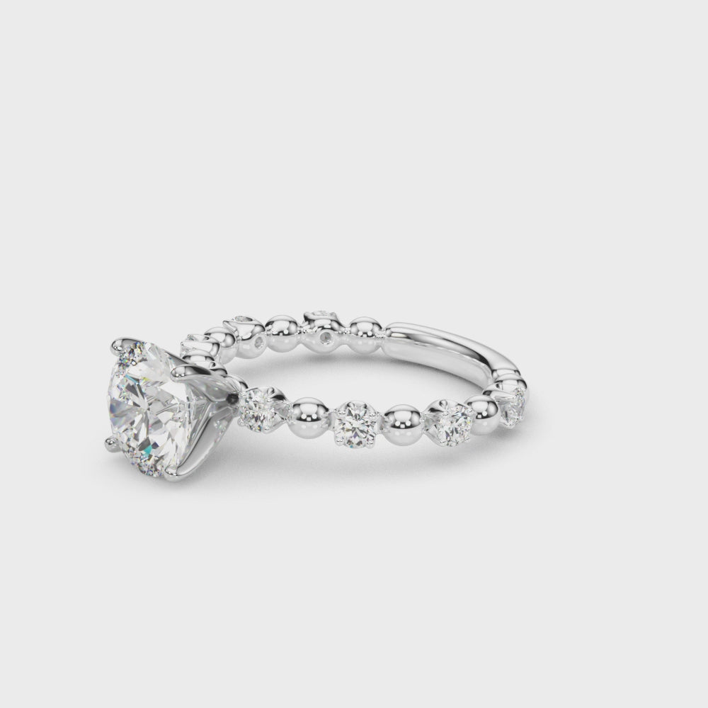 Video showcasing the round diamond engagement ring with a white gold beaded band.