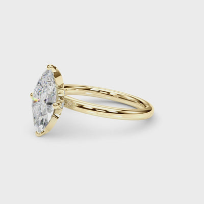 Rotating view of the yellow gold marquise engagement ring showing the pavé leaf gallery beneath the diamond.
