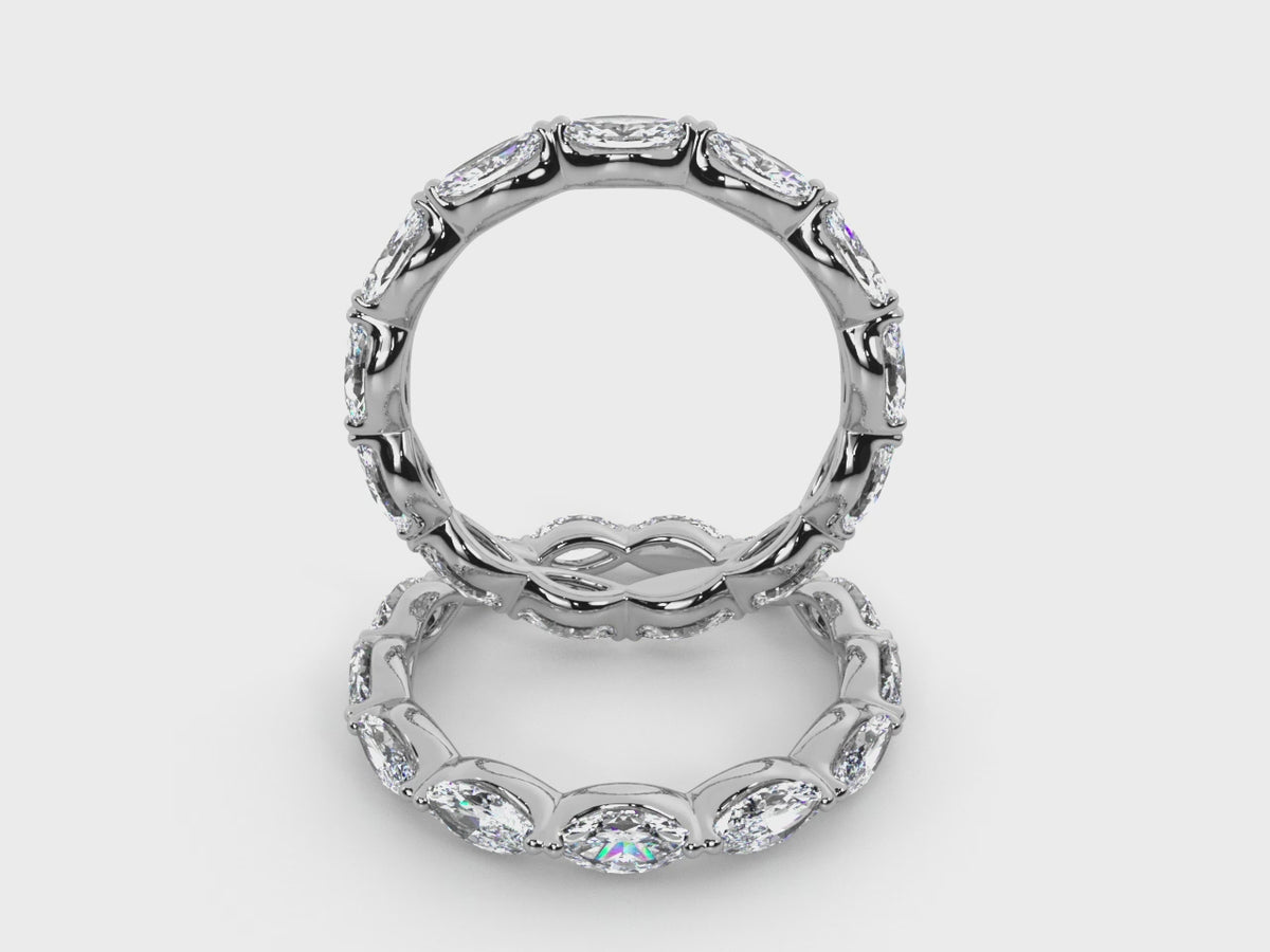 Rotating views of the 14K white gold east-west marquise diamond eternity band.