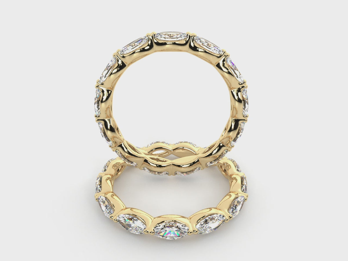 Rotating views of the 14K yellow gold east-west marquise diamond eternity band.