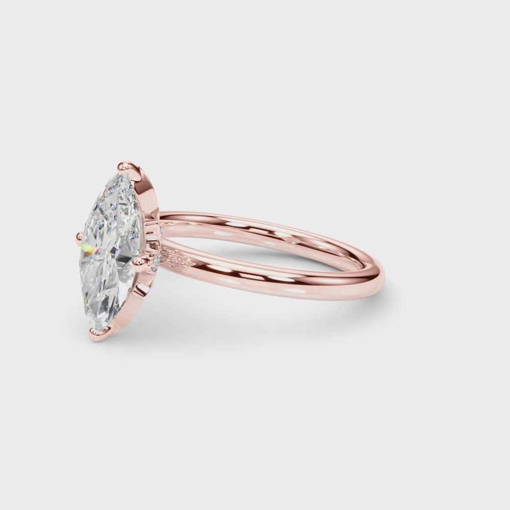 Rotating view of the rose gold marquise diamond ring showing its leaf-inspired gallery and smooth band.