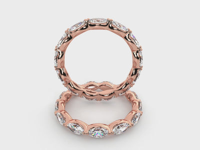 Rotating views of the 14K rose gold east-west marquise diamond eternity band.