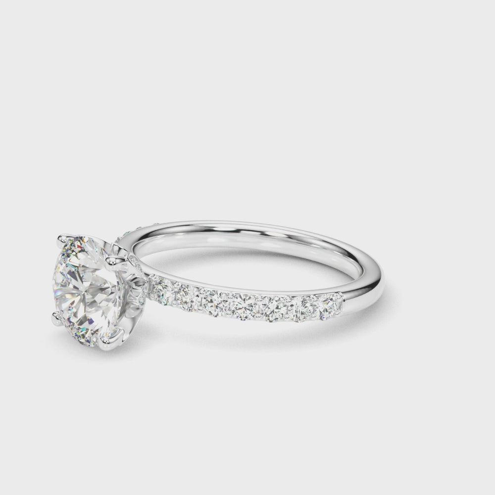 360° view of 2.00 carat IGI certified round diamond engagement ring in 14K gold — showcases brilliance, pavé band, and hidden halo detailing.