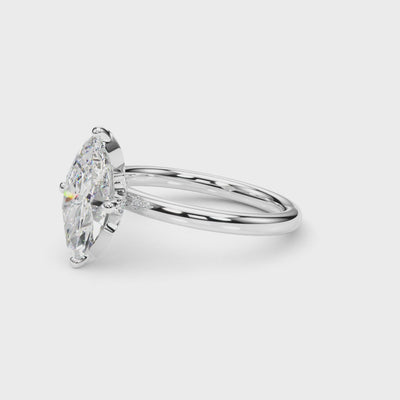Rotating view of the white gold marquise diamond ring showing the pavé leaf gallery and polished band.