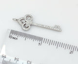 Tiffany & Co. Platinum Fleur De Lis Diamond Key Pendant - simonbjewels.co